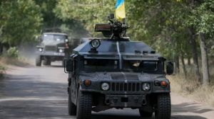 Ukrainian servicemen ride in an armoured vehicle in Kramatorsk