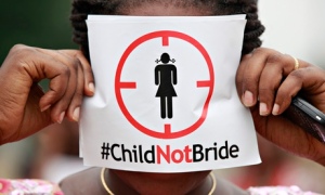 A woman in Lagos protests against underage marriages in Nigeria.