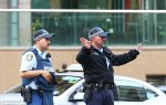 Armed police storm government building on Sydney's Oxford Street and evacuate workers following threats 2