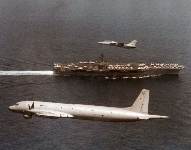 may-1996-an-f-14-tomcat-escorts-a-russian-spy-plane-as-it-passes-over-the-carrier-constellation-cv-641